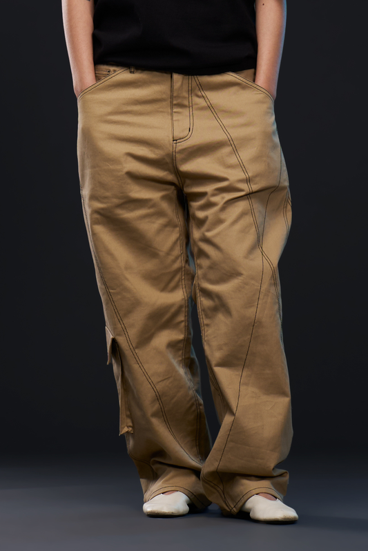 NODE. PANTS in khaki — front, worn on model, hands in pockets