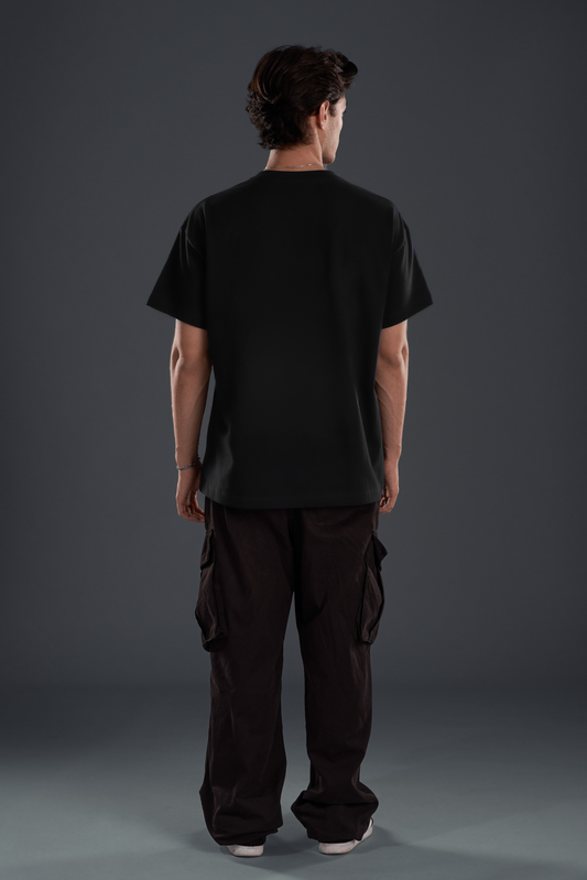 BLIND DROP. TEE in black — back, worn on model