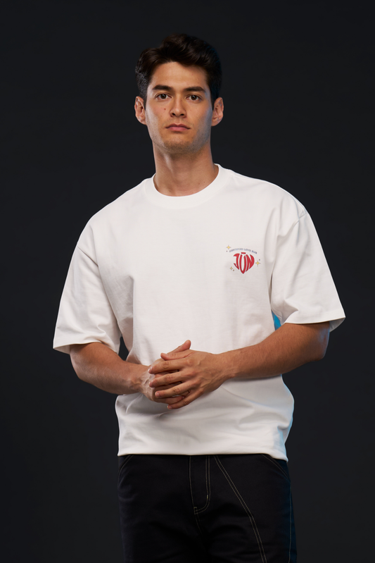 LOVE BUG. TEE in white — front, worn on model, chest heart logo