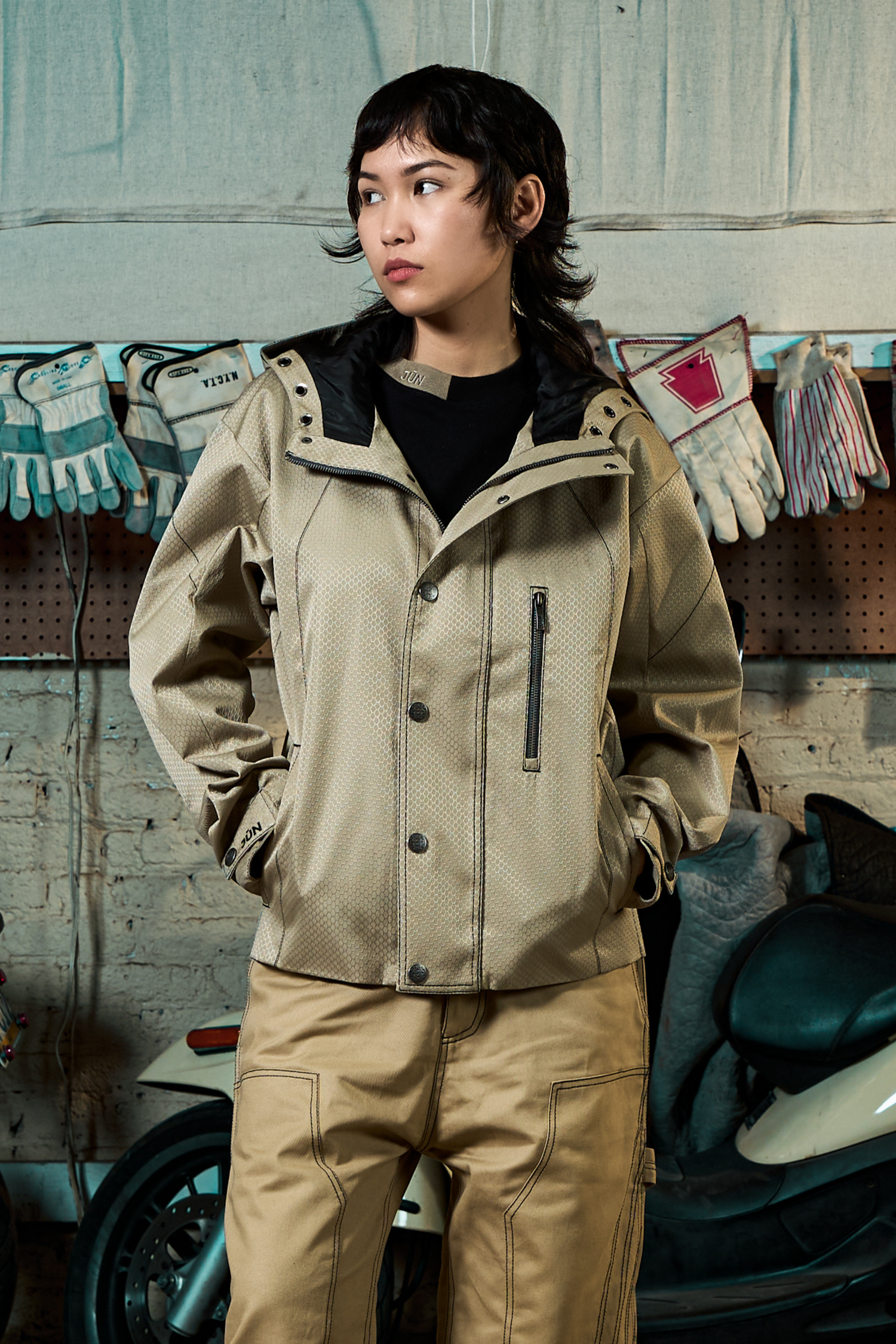 NOVA. JKT in khaki — front, worn, garage setting