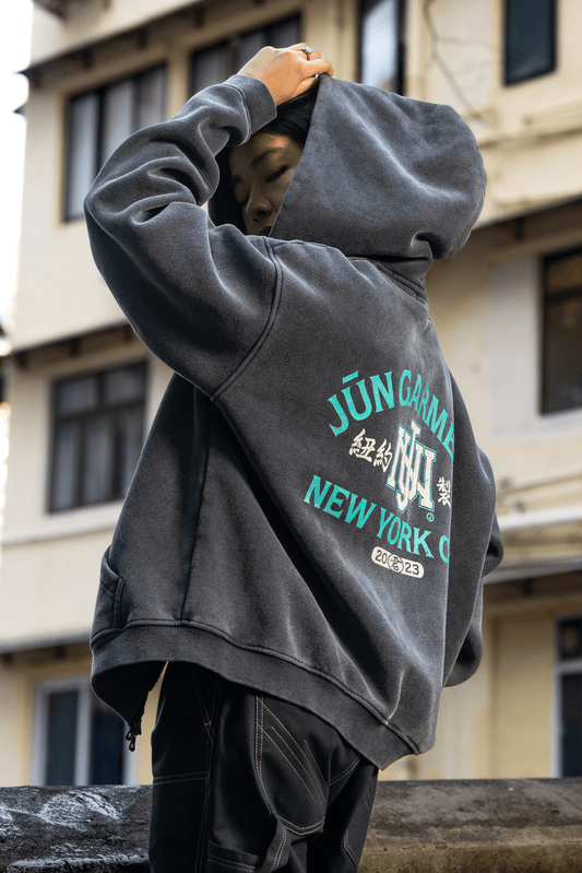 RELIC. HOODIE in gray — back, worn on model, hood up, JŬN GARMENT graphic