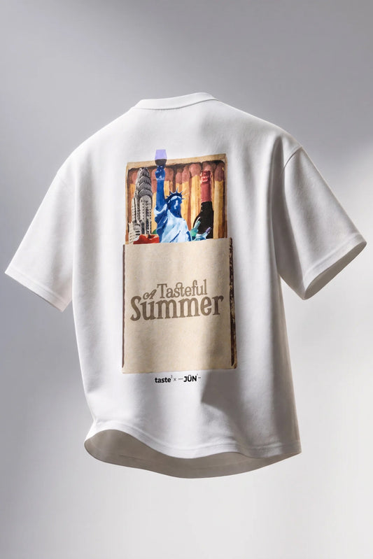 MATCHBOX. TEE (TASTE APP COLLAB) — back, floating product shot, matchbox graphic with Statue of Liberty and A Tasteful Summer text