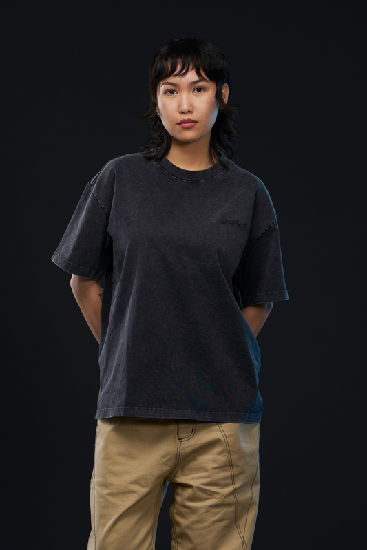 ETCH. LOGO ACID TEE in black — front, worn on model