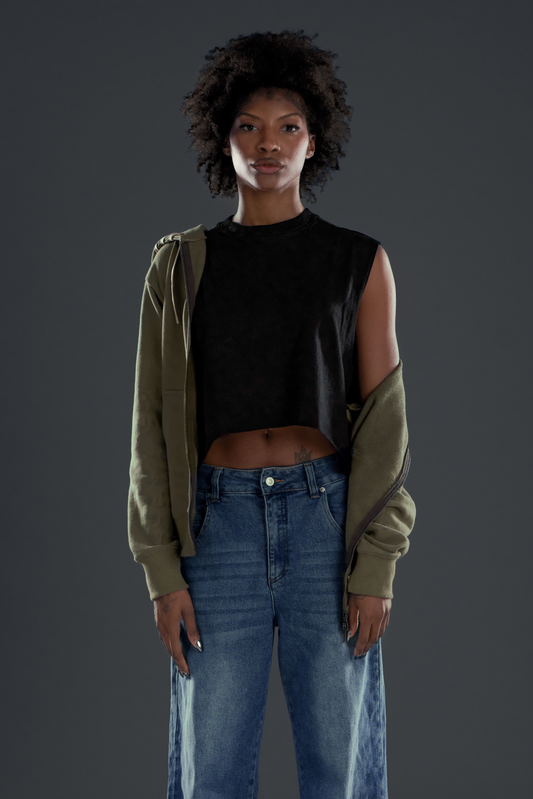 DAWN. ZIP UP in green — worn open, layered over a black crop top