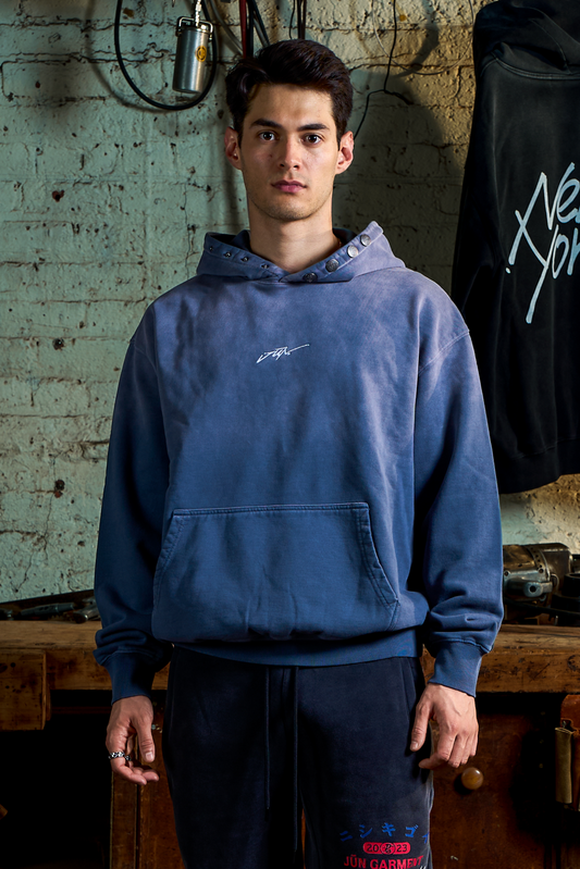 ETCH. HOODIE in blue — front, worn on model