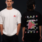 ICHIGO. TEE in white and black — worn, two models side by side, white chest logo and black back strawberry graphic