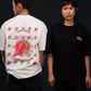 ICHIGO. TEE in white and black — worn, two models side by side, white back strawberry graphic and black chest logo