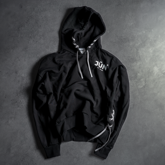 DAWN. HOODIE — lifestyle, two models in black and white pairs, night street scene