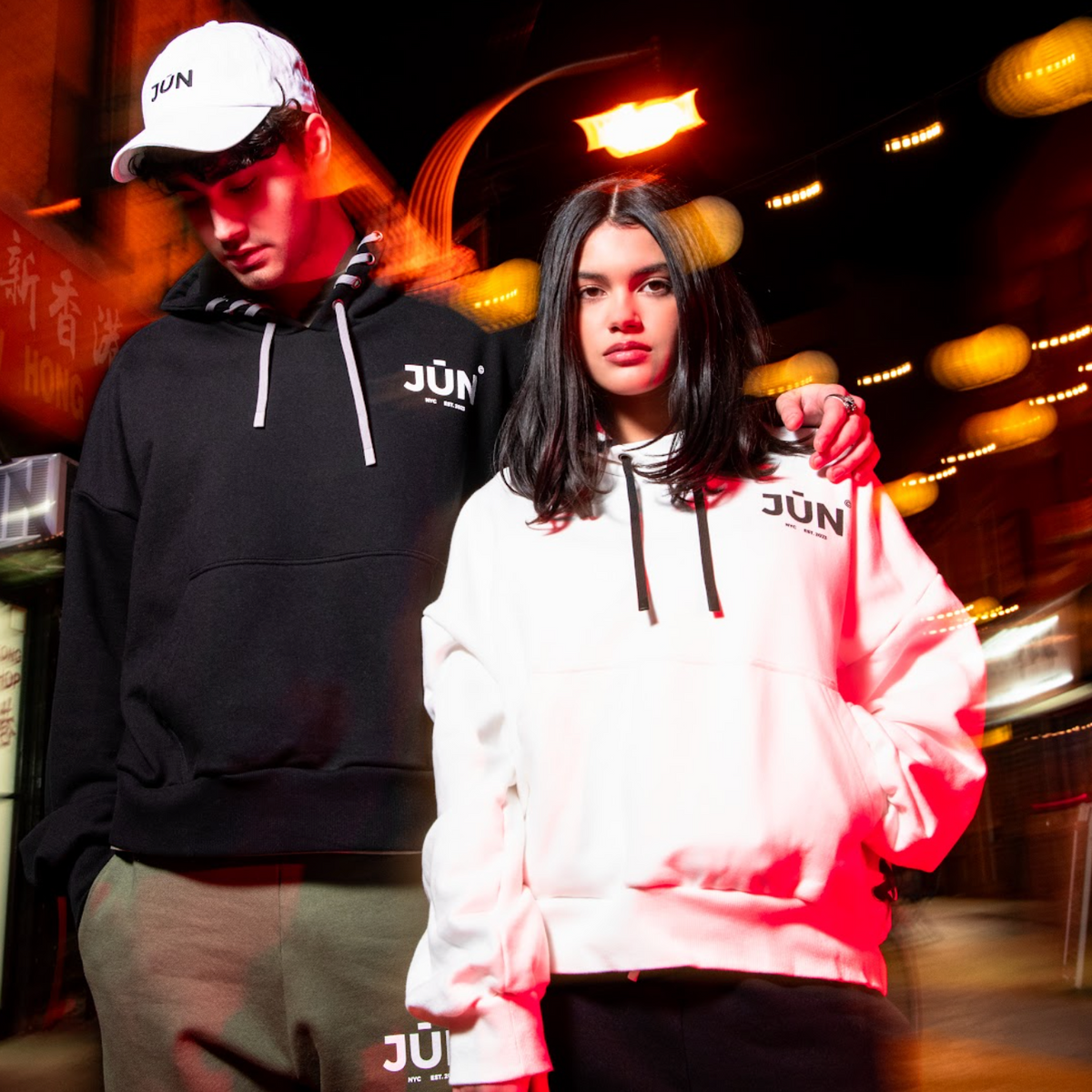 DAWN. HOODIE — lifestyle, motion blur, two models in black and white, night street scene