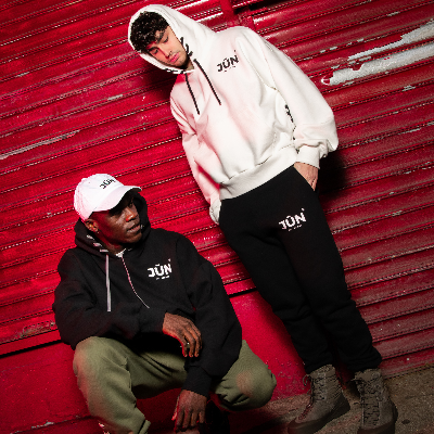 DAWN. SWEATS — lifestyle, two models in black and green pairs styled with JŪN hoodies