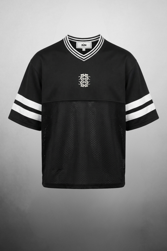 BLACKOUT 23. JERSEY in black — front, flat lay, mesh body and striped sleeves